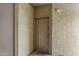Exterior entrance to unit 3034 with a sturdy front door and textured walls at 18416 N Cave Creek Rd # 3034, Phoenix, AZ 85032