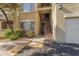 Apartment exterior with private entrance stairway and attached single-car garage at 18416 N Cave Creek Rd # 3034, Phoenix, AZ 85032