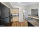 Well-lit kitchen features wood floors, modern appliances, and laminate countertops at 18416 N Cave Creek Rd # 3034, Phoenix, AZ 85032