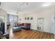Inviting living area with wood flooring, a modern ceiling fan, and large windows at 18416 N Cave Creek Rd # 3034, Phoenix, AZ 85032