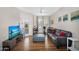 Warm living room with hardwood floors, and a door leading to a private balcony at 18416 N Cave Creek Rd # 3034, Phoenix, AZ 85032