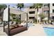 Relaxing poolside cabana with plush seating and a nearby hot tub at 18416 N Cave Creek Rd # 3034, Phoenix, AZ 85032