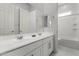 Bright bathroom featuring neutral walls, tile flooring, double vanity and modern trim at 18508 W Galveston St, Goodyear, AZ 85338
