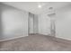 Open bedroom with neutral carpet, a modern ceiling fan, recessed lighting, and two entryways at 18508 W Galveston St, Goodyear, AZ 85338