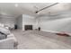 Spacious two car garage featuring concrete floors, an automatic garage door, and gray painted walls at 18508 W Galveston St, Goodyear, AZ 85338
