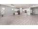 Bright, open-concept kitchen featuring a large island, stainless steel appliances, and modern white cabinets at 18508 W Galveston St, Goodyear, AZ 85338