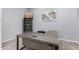 Bright office featuring neutral walls, plush carpeting, modern desk and shelving at 18508 W Galveston St, Goodyear, AZ 85338