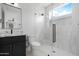 Contemporary bathroom with a glass shower, black fixtures, and granite vanity at 19622 W Pasadena Ave, Litchfield Park, AZ 85340