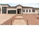 A welcoming single-Gathering home featuring a paved entryway and desert landscaping at 19622 W Pasadena Ave, Litchfield Park, AZ 85340