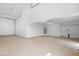 A spacious and well-lit three car garage at 19622 W Pasadena Ave, Litchfield Park, AZ 85340