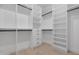 Organized walk-in closet with custom shelving and drawers for ample storage space at 19622 W Pasadena Ave, Litchfield Park, AZ 85340