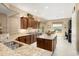 Spacious kitchen with granite counters, stainless appliances, a central island, and a cozy breakfast nook at 20140 N 269Th Dr, Buckeye, AZ 85396