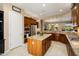 Gourmet kitchen with stainless steel appliances, granite countertops, and a convenient center island at 20140 N 269Th Dr, Buckeye, AZ 85396