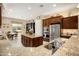 This gourmet kitchen has a large island and breakfast nook with stainless steel appliances at 20140 N 269Th Dr, Buckeye, AZ 85396