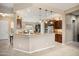 Open concept kitchen with granite countertops, stainless steel appliances and tile floors at 20140 N 269Th Dr, Buckeye, AZ 85396