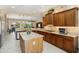 Open kitchen featuring a center island, granite countertops, and stainless steel appliances at 20140 N 269Th Dr, Buckeye, AZ 85396