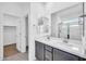 Bathroom with a double vanity, light countertops, walk-in shower and neutral colors at 20808 W Granada Rd, Buckeye, AZ 85396
