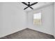 Bedroom boasts a modern ceiling fan, plush carpeting, and ample natural light at 20808 W Granada Rd, Buckeye, AZ 85396