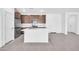 Bright kitchen with stainless steel appliances, island with sink, and tile backsplash at 20808 W Granada Rd, Buckeye, AZ 85396