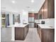 Open floor plan featuring the kitchen, with a large island and stainless steel appliances at 20808 W Granada Rd, Buckeye, AZ 85396