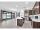 Spacious kitchen and dining area with sliding glass doors to backyard at 20808 W Granada Rd, Buckeye, AZ 85396