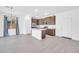 Spacious living room featuring an open-concept kitchen, tile floors, and recessed lighting at 20808 W Granada Rd, Buckeye, AZ 85396