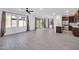 Bright living space with tile flooring, neutral walls, big windows, and a sliding glass door at 20808 W Granada Rd, Buckeye, AZ 85396