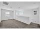 Spacious carpeted loft area filled with natural light from several windows at 20808 W Granada Rd, Buckeye, AZ 85396