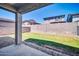 Covered patio with view of the backyard offers an ideal spot for relaxing and enjoying the outdoors at 20808 W Granada Rd, Buckeye, AZ 85396