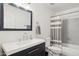 Contemporary bathroom with a modern vanity, sleek fixtures, and stylish mirror at 2236 E Rawhide St, Gilbert, AZ 85296