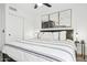 Comfortable bedroom featuring ocean wave artwork, and ample natural light at 2236 E Rawhide St, Gilbert, AZ 85296