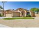 Charming single-story home featuring an arched entryway, low maintenance desert landscaping at 2236 E Rawhide St, Gilbert, AZ 85296