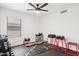 A well-equipped home gym featuring free weights, weight bench and rubber flooring at 2236 E Rawhide St, Gilbert, AZ 85296