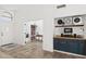 Open living space with a view into the office area, a charming console, and views of the front entry at 2236 E Rawhide St, Gilbert, AZ 85296