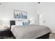 Cozy main bedroom featuring a skyline picture, bedside table, and modern furnishings at 2236 E Rawhide St, Gilbert, AZ 85296