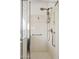 Modern walk-in shower with safety grab bars and a rainfall showerhead at 2236 E Rawhide St, Gilbert, AZ 85296