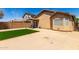 The backyard showcases a compact lawn area, perfect for relaxation and entertainment at 22745 W Cocopah St, Buckeye, AZ 85326