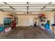 Spacious garage interior with ample storage space, work area, and overhead lighting at 22745 W Cocopah St, Buckeye, AZ 85326