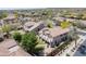 A high angle view of a home with a balcony, yard, and desert landscaping at 2307 W Sienna Bouquet Pl, Phoenix, AZ 85085