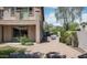 Backyard showcasing pavers, built-in BBQ, lush landscaping, and mature greenery at 2307 W Sienna Bouquet Pl, Phoenix, AZ 85085