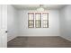 Empty room filled with neutral carpet, three window frames, and white colored walls at 2307 W Sienna Bouquet Pl, Phoenix, AZ 85085
