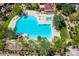 Aerial view of a community pool, hot tub, lounge seating, and landscaping at 2307 W Sienna Bouquet Pl, Phoenix, AZ 85085