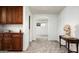 Hallway with wood cabinets and views into other rooms at 2307 W Sienna Bouquet Pl, Phoenix, AZ 85085