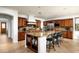 This gourmet kitchen boasts an oversized island and ample cabinet space for storage at 2307 W Sienna Bouquet Pl, Phoenix, AZ 85085