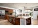 Open concept kitchen featuring a large central island and stainless steel appliances at 2307 W Sienna Bouquet Pl, Phoenix, AZ 85085