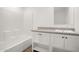 Bathroom with white cabinets at 23117 W Duane Ln, Wittmann, AZ 85361