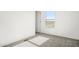 Bedroom with carpet flooring and window at 23117 W Duane Ln, Wittmann, AZ 85361