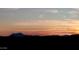 Beautiful view of a colorful sunset at 23117 W Duane Ln, Wittmann, AZ 85361
