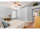 Bright bedroom featuring ceiling fan and wood-look flooring at 2727 S 160Th Ln, Goodyear, AZ 85338
