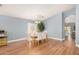 Well-lit dining area with wood floors and a view to other rooms at 2727 S 160Th Ln, Goodyear, AZ 85338